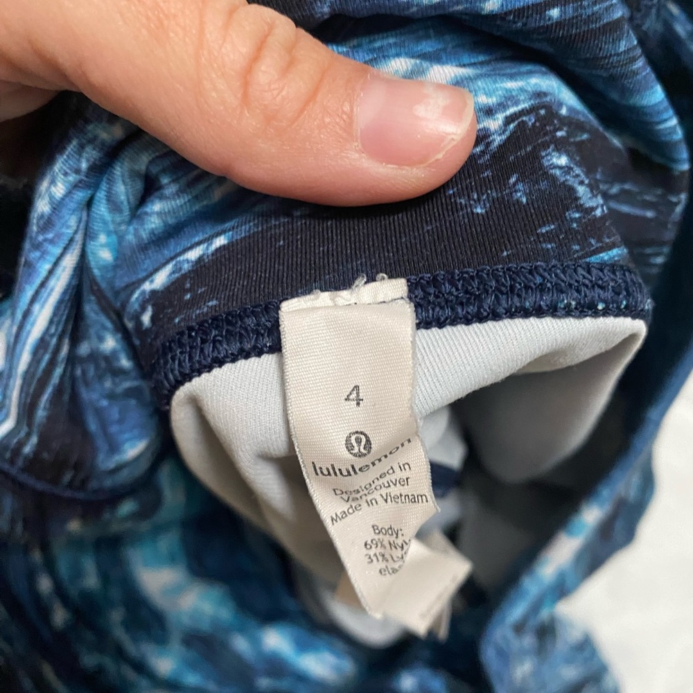 Lululemon tights. Blue water pattern with mesh detail. 7/8 length